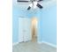 Light blue bedroom with wood-look floors and double closets at 992 Carnation Dr, Winter Park, FL 32792