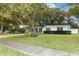 Mid-century modern home with mature landscaping and curb appeal at 992 Carnation Dr, Winter Park, FL 32792