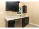 Kitchen with stainless steel dishwasher and dark cabinets at 992 Carnation Dr, Winter Park, FL 32792