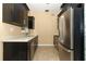 Modern kitchen with stainless steel appliances and light countertops at 992 Carnation Dr, Winter Park, FL 32792