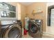 Convenient laundry room with washer, dryer, and ample storage at 992 Carnation Dr, Winter Park, FL 32792
