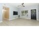 Living room with wood-look floors, and a view into the kitchen at 992 Carnation Dr, Winter Park, FL 32792