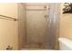 Tiled shower with glass enclosure and neutral tones at 992 Carnation Dr, Winter Park, FL 32792