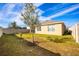 Landscaped backyard with young trees and privacy fence at 1016 Brooklet Dr, Davenport, FL 33837