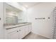Bathroom with double vanity, granite countertop, and shower at 1016 Brooklet Dr, Davenport, FL 33837
