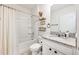 Bathroom with a single vanity, tub, and white finishes at 1016 Brooklet Dr, Davenport, FL 33837