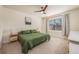 Main bedroom with king bed, ample natural light, and ceiling fan at 1016 Brooklet Dr, Davenport, FL 33837