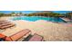 Large community pool with surrounding lounge chairs and patio area at 1016 Brooklet Dr, Davenport, FL 33837
