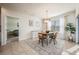 Bright dining room with wood table and chairs, and access to backyard at 1016 Brooklet Dr, Davenport, FL 33837