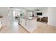 Open concept kitchen with island, granite countertops, and view of living area at 1016 Brooklet Dr, Davenport, FL 33837
