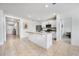 Open kitchen features island, stainless steel appliances, and granite countertops at 1016 Brooklet Dr, Davenport, FL 33837
