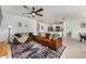 Spacious living room with leather couches and a large TV at 1016 Brooklet Dr, Davenport, FL 33837