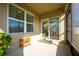 Screened patio with sliding door access and small side table at 1016 Brooklet Dr, Davenport, FL 33837