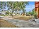 House with a view of a tree-lined street and other homes at 1137 Oaks Blvd, Winter Park, FL 32789