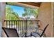 Private balcony overlooking community with seating at 120 Palermo St, Davenport, FL 33897