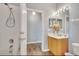 Bathroom with shower, vanity, and wood cabinets at 120 Palermo St, Davenport, FL 33897