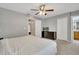 Main bedroom with king-size bed and ceiling fan at 120 Palermo St, Davenport, FL 33897