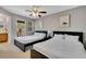 Spacious bedroom with two beds and balcony access at 120 Palermo St, Davenport, FL 33897