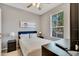 Cozy bedroom with a double bed and ceiling fan at 120 Palermo St, Davenport, FL 33897