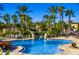 Inviting kidney-shaped community pool with lounge chairs at 120 Palermo St, Davenport, FL 33897
