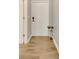 Light and bright entryway with wood-look tile flooring and shoe rack at 120 Palermo St, Davenport, FL 33897