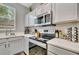 Kitchen features gas stove, microwave, and ample counter space at 120 Palermo St, Davenport, FL 33897