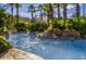 Enjoyable lazy river winding through a tropical landscape at 120 Palermo St, Davenport, FL 33897