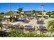 Relaxing poolside space with tables, chairs, and a tiki bar at 120 Palermo St, Davenport, FL 33897