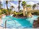 Relaxing resort-style pool with a bridge and lush landscaping at 120 Palermo St, Davenport, FL 33897