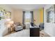 Home office with a desk, chair, and gray accent chair at 1324 Hanoverian Dr, Lake Alfred, FL 33850