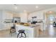 Modern kitchen with white cabinets, granite countertops and island at 1324 Hanoverian Dr, Lake Alfred, FL 33850