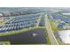 Aerial view of community with lake and homes at 14025 Kauai Dr, Orlando, FL 32827