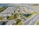 Aerial view of a new community with many houses and a lake at 14025 Kauai Dr, Orlando, FL 32827