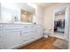 Double vanity bathroom with walk-in shower and closet at 14025 Kauai Dr, Orlando, FL 32827