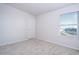 Spacious bedroom featuring a window with blinds at 14025 Kauai Dr, Orlando, FL 32827