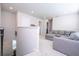 Upstairs bonus room with L-shaped sectional sofa and hallway access at 14025 Kauai Dr, Orlando, FL 32827