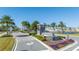 Gated community entrance with a fountain and landscaping at 14025 Kauai Dr, Orlando, FL 32827