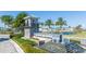 Community entrance with stonework and palm trees at 14025 Kauai Dr, Orlando, FL 32827