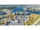 Aerial view of community with pool, tennis courts, and homes at 14025 Kauai Dr, Orlando, FL 32827