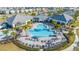 Large community pool with surrounding lounge chairs at 14025 Kauai Dr, Orlando, FL 32827
