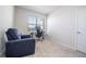 Bright home office with window, desk, and comfortable recliner at 14025 Kauai Dr, Orlando, FL 32827