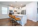 Modern kitchen with white shaker cabinets, stainless steel appliances, and an island at 14025 Kauai Dr, Orlando, FL 32827
