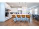 Kitchen island with tan leather barstools and white cabinetry at 14025 Kauai Dr, Orlando, FL 32827