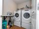 Convenient laundry room with washer, dryer, and folding surface at 14025 Kauai Dr, Orlando, FL 32827
