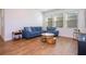 Spacious living area with hardwood floors and a comfortable sectional sofa at 14025 Kauai Dr, Orlando, FL 32827