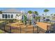 playground with modern equipment and wood-chip safety surface at 14025 Kauai Dr, Orlando, FL 32827