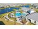Aerial view of community pool with clubhouse, palm trees, and lounge areas at 14025 Kauai Dr, Orlando, FL 32827