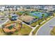 Aerial view of community tennis and basketball courts with playground at 14025 Kauai Dr, Orlando, FL 32827