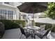 Relaxing patio featuring a table, chairs, and umbrella at 1641 Lake Baldwin Ln, Orlando, FL 32814