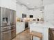 Modern kitchen with stainless steel appliances and white cabinetry at 1641 Lake Baldwin Ln, Orlando, FL 32814